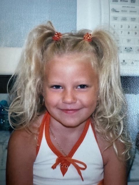 Abbi as a young girl with pigtails