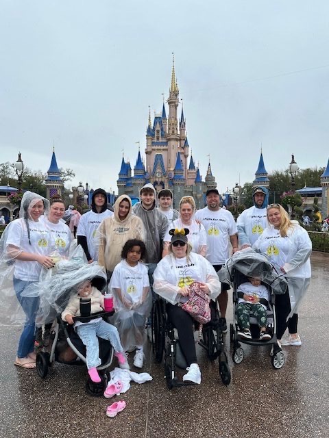 Abbi with her family at Disney World wearing 'I Fight For Abbi' shirts — a community of love