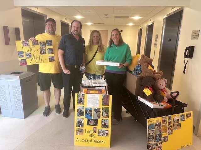 Group with donation bags in adolescent hospital unit